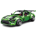 Green toy car model on a white background