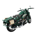 Green motorcycle model made of interlocking bricks on a white background