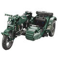 Green toy motorcycle model on a white background