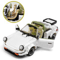 Toy car model with open doors and detailed interior, featuring adjustable seat mechanism.